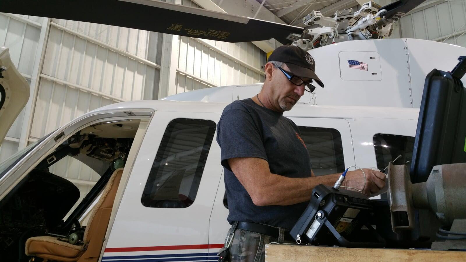 A SEAL Aviation NDT Tech preparing to perform an eddy current inspection on a helipcopter