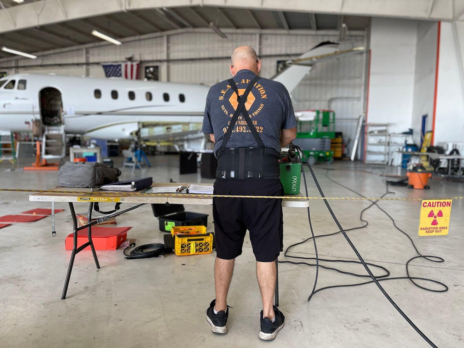 A SEAL Aviation NDT Tech preparing to shoot xrays