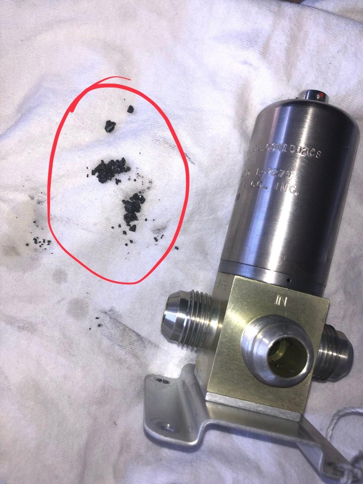 Debris discovered in motive flow shutoff valve