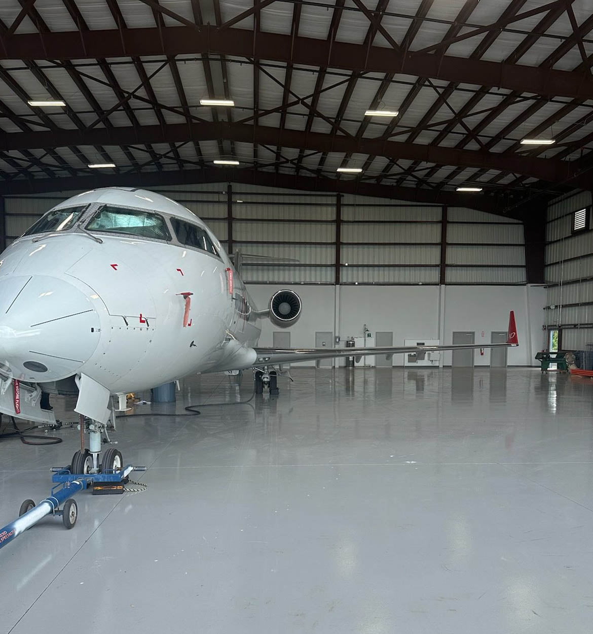 SEAL Aviation repairing the first aircraft in the new Fort Pierce hangar, a CRJ 200