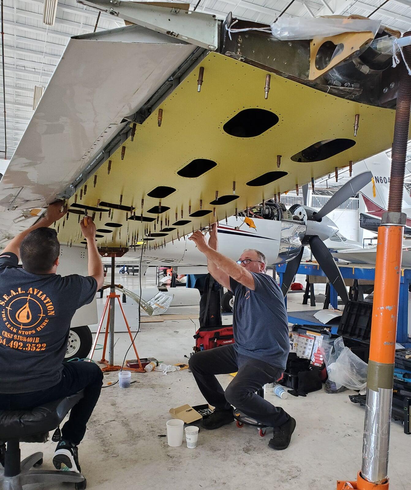 Installing lower wing skin on a Piper
